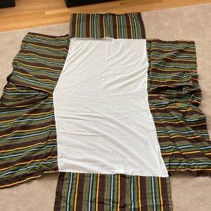 Bedskirt never used. Brown. Green. Blue and orange.